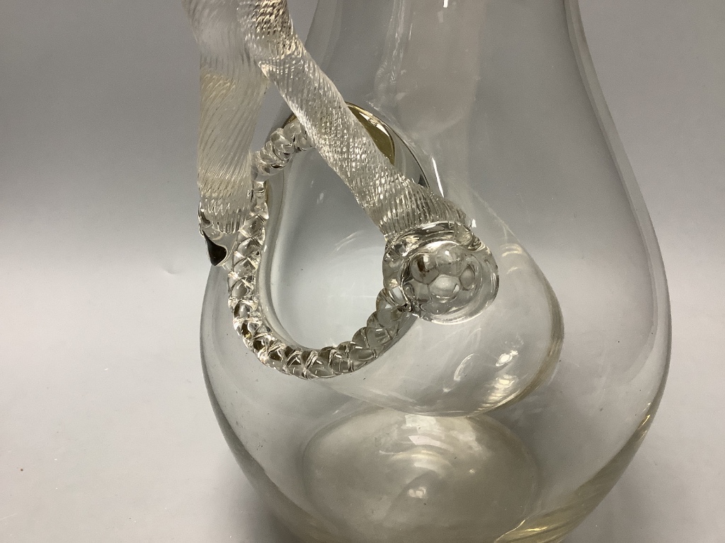 A 19th century glass lemonade jug with snake handle and ice compartment, height 33cm